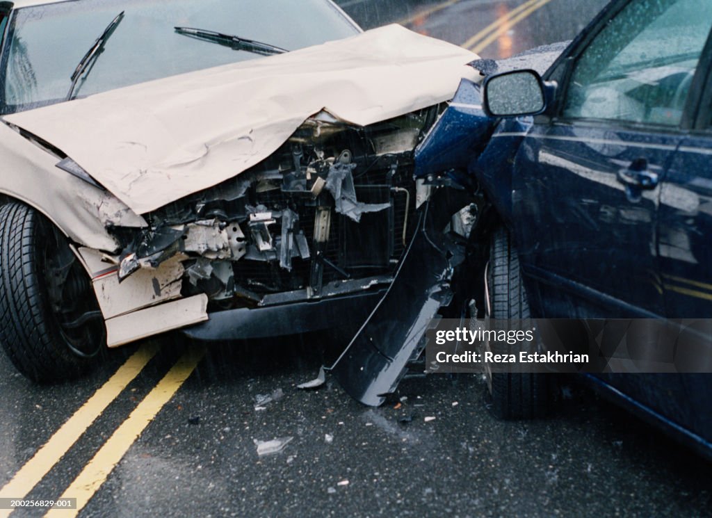 Two damaged cars after crash, close-up