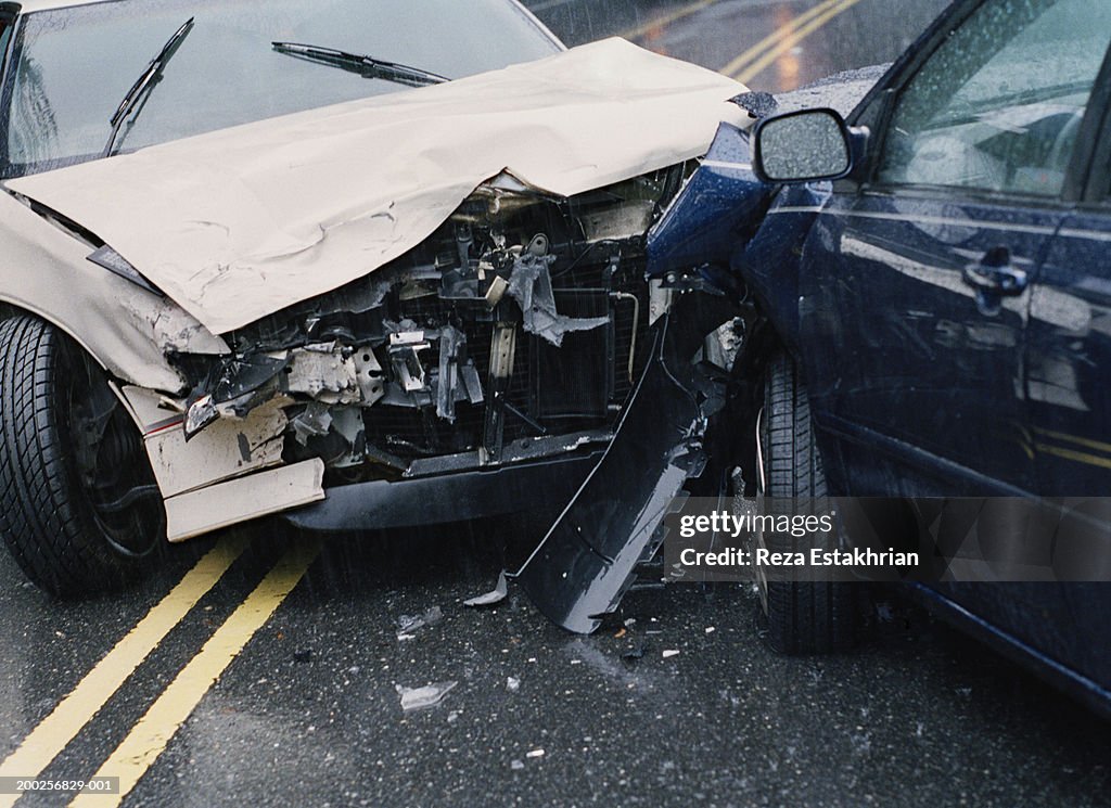 Two damaged cars after crash, close-up
