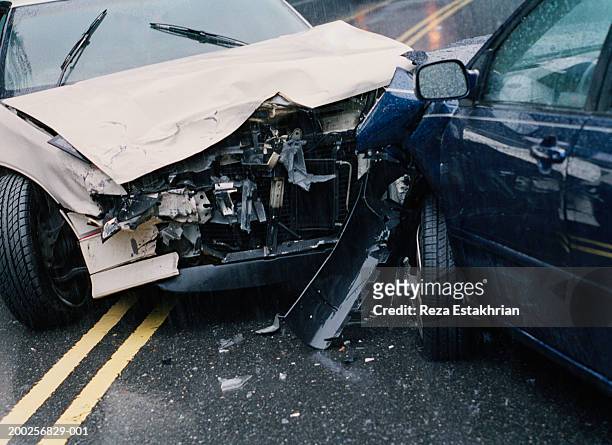 two damaged cars after crash, close-up - crash imagens e fotografias de stock