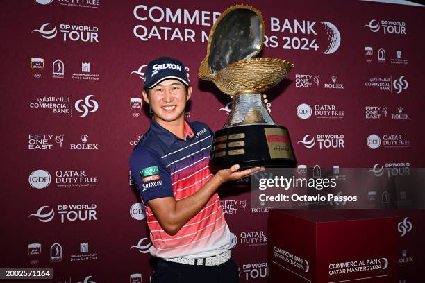 Rikuya Hoshino of Japan celebrates victory with the trophy during day four of the Commercial Bank Qatar Masters at Doha Golf Club on February 11,...