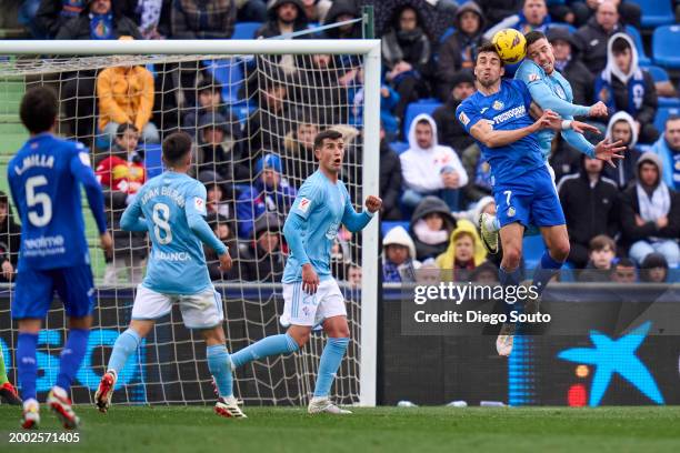 Jaime Mata of Getafe CF battle for the ball with Mihailo Ristic of Celta Vigo during the LaLiga EA Sports match between Getafe CF and Celta Vigo at...