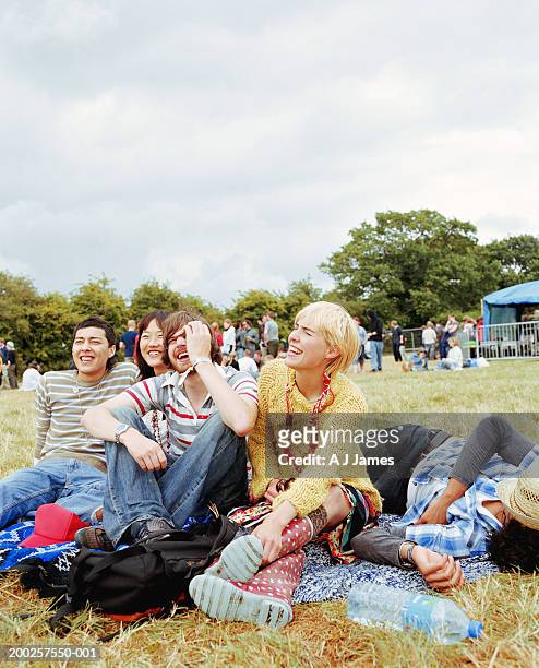 group of friends on grass, laughing - native korean stock pictures, royalty-free photos & images
