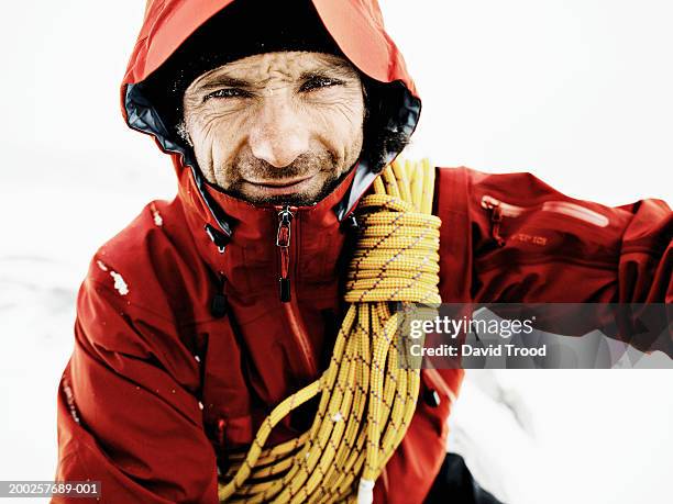 male mountain climber with rope over shoulder, close-up, portrait - extreme close up fotografías e imágenes de stock