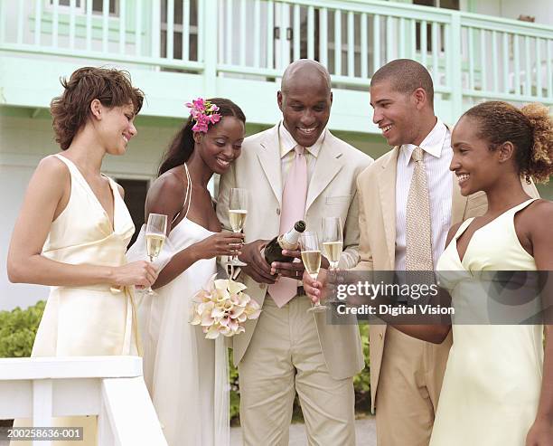 groom pouring champagne for bride, bridesmaids and best man, smiling - best man stock pictures, royalty-free photos & images