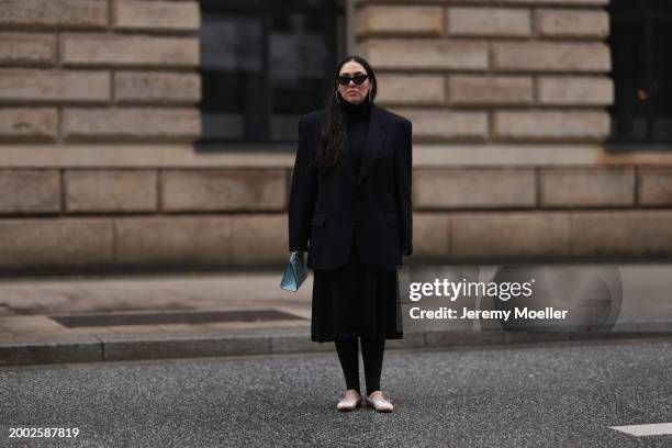 Jennifer Casimiro seen wearing black sunglasses, silver diamond earrings / hoops, Vintage black oversized blazer, COS black high neck cotton pleated...