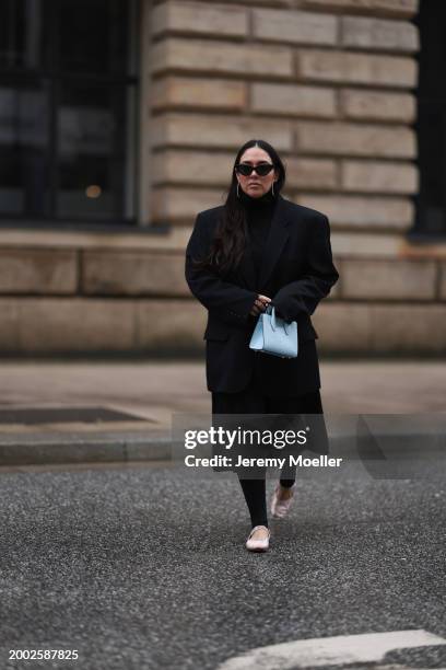 Jennifer Casimiro seen wearing black sunglasses, silver diamond earrings / hoops, Vintage black oversized blazer, COS black high neck cotton pleated...