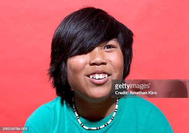 boy (11-13) with bangs covering eye, smiling, close-up - korean teen stock pictures, royalty-free photos & images