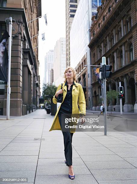 young woman walking in street - martin place sydney stock pictures, royalty-free photos & images