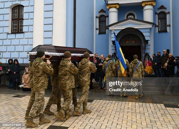 People attend a funeral ceremony of German female combat medic Diana Wagner in St. Michael's Golden-Domed Monastery in Kyiv, Ukraine, on February 14,...