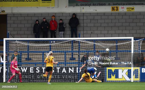 Katie Robinson of Brighton & Hove Albion scores her team's first goal during the Adobe Women's FA Cup Fifth Round match between Wolverhampton...