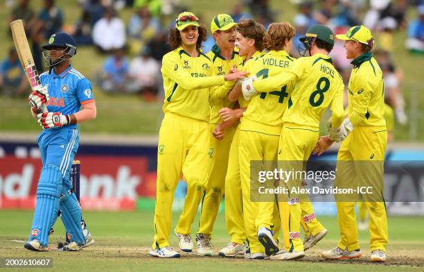 Rafael MacMillan of Australia celebrates the wicket of Sachin Dhas of India with teammates during the ICC U19 Men's Cricket World Cup South Africa...