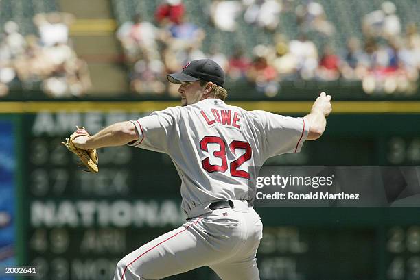 Derek Lowe of the Boston Red Sox throws a pitch during the game against the Texas Rangers at the Ballpark in Arlington on April 24, 2003 in...