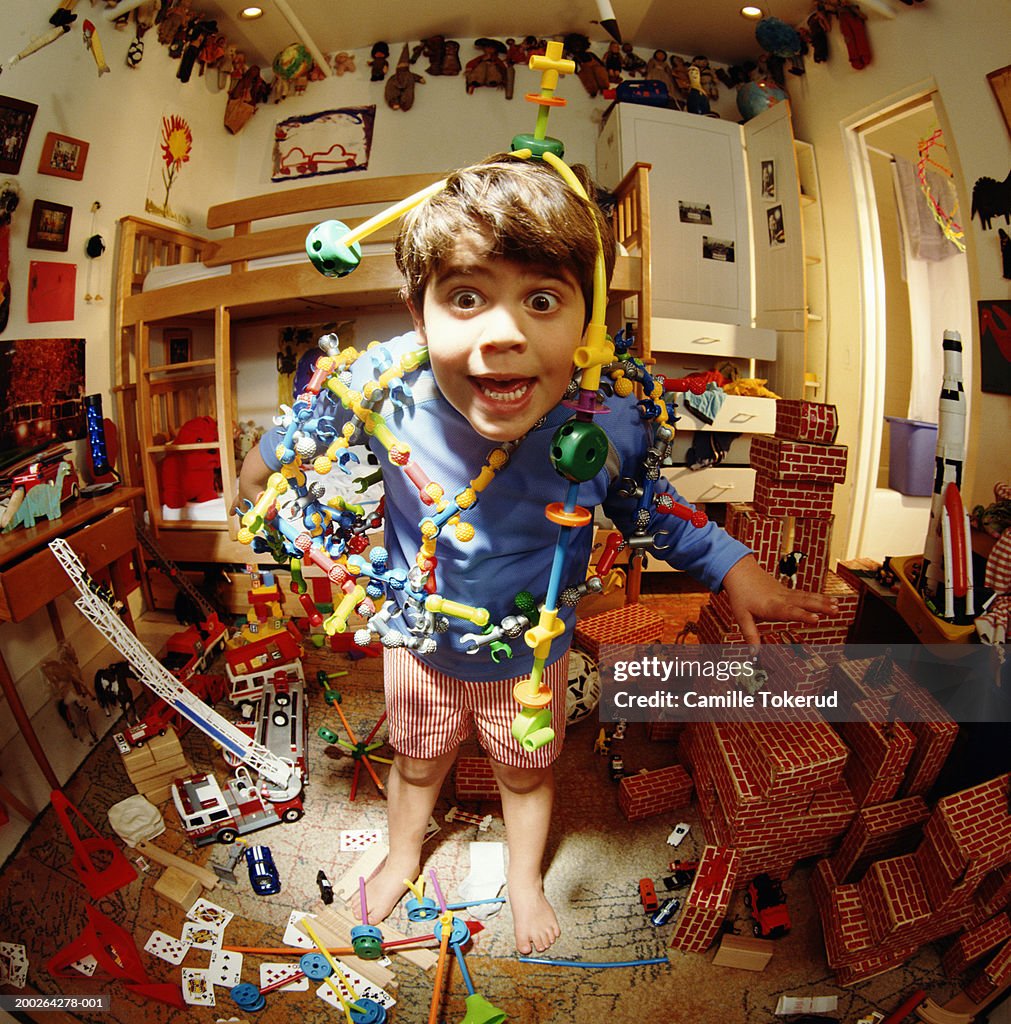 Boy (4-6) playing with toys in bedroom (fisheye)