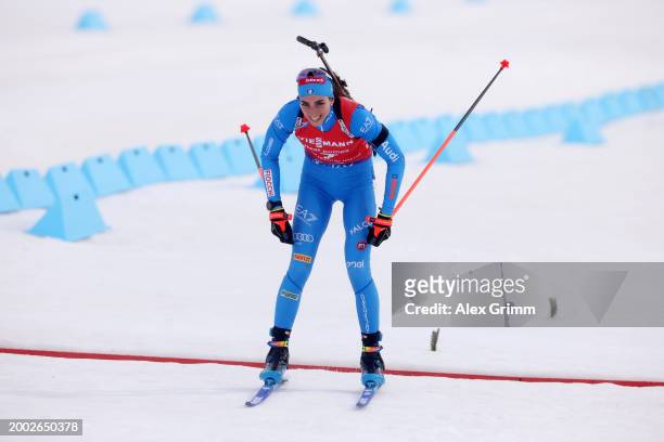 Lisa Vittozzi of Italy celebrates as she crosses the finish line for second place in Women's 10k Pursuit at the IBU World Championships Biathlon Nove...