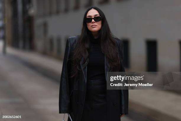 JJennifer Casimiro seen wearing Prada black Symbole sunglasses, Wolford black wool knit turtleneck pullover, Mango x Jen Ceballos black leather long...