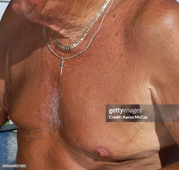 shirtless senior man wearing necklaces and cross, mid section - body positive men stock pictures, royalty-free photos & images