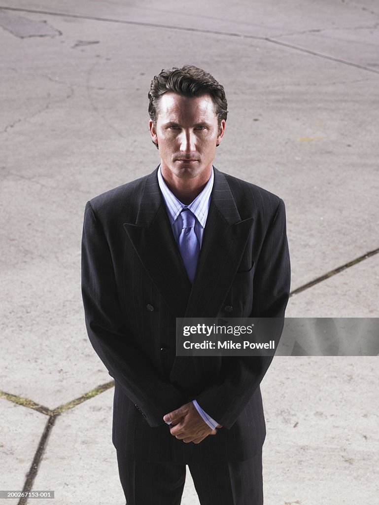 Businessman standing on street