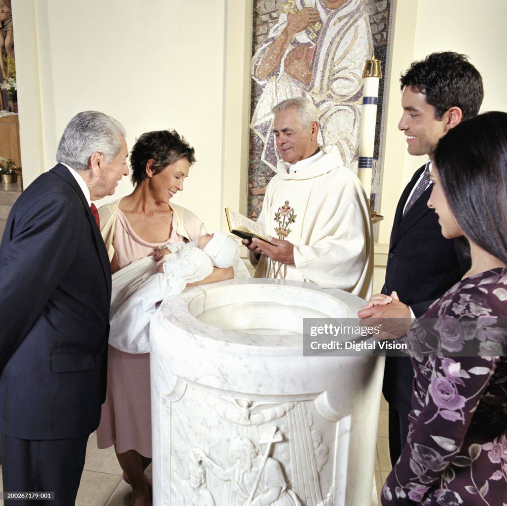 Baby boy (0-3 months) being baptised