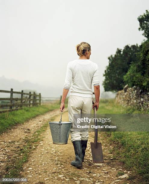 Bucket Woman Woman Carrying Bucket Photos and Premium High Res Pictures - Getty Images