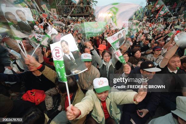 Over 100,000 people pack the streets outside the Democratic Progressive Party headquarters, 18 March 2000 in Taipei, as the pro-independence party...