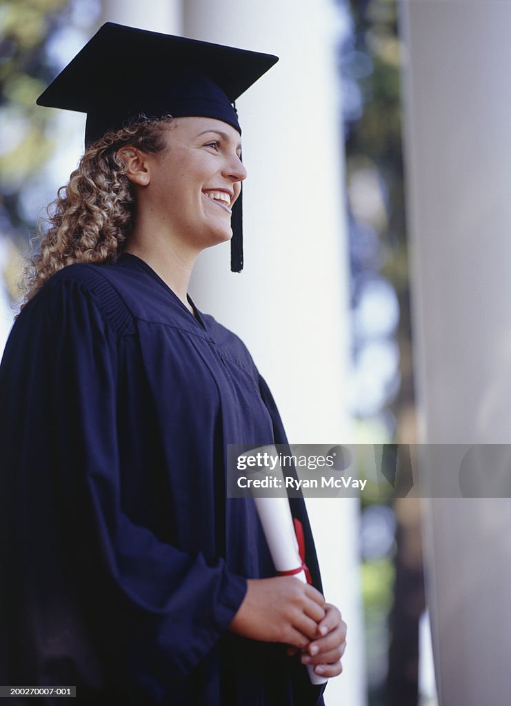 Side View Graduated Graduate Student Holding Diploma Side View High-Res Stock Photo - Getty ...