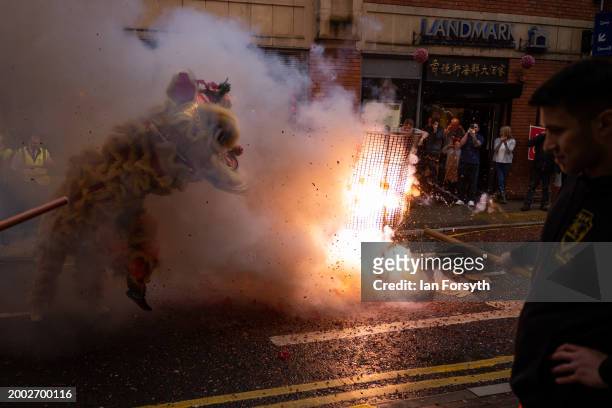 Firecrackers explode in the street as the traditional Lion Dance performance visits restaurants in Newcastle’s Chinatown to bring good luck during...