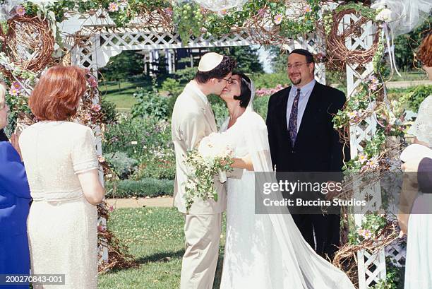 bride and groom kissing at wedding ceremony - wedding ceremony bildbanksfoton och bilder