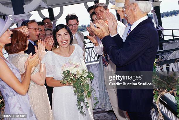 group of guests applauding bride and groom at wedding ceremony - jewish wedding ceremony stock pictures, royalty-free photos & images