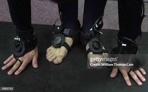 University of Pennsylvania student Aaron Bloomfield's hands and feet are seen while he stretches in preparation to demonstrate the LiveActor stereo...