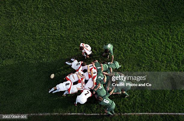 rugby scrummage, overhead view - rugby player stock-fotos und bilder