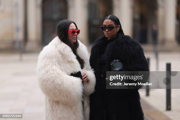 Jennifer Casimiro seen wearing Mango red sunglasses, Ducie London creamy white mongolian shearling long coat, Wolford black wool knit turtleneck...