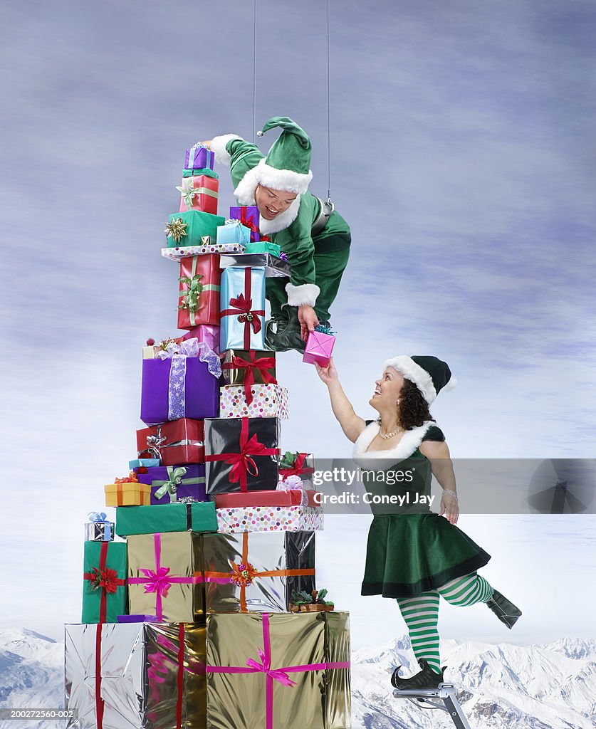 Two 'Elves' by large pile of presents (digital composite)