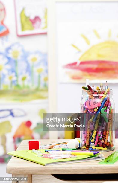 jar of crayons on child's desk, close-up - elementary school building stock pictures, royalty-free photos & images