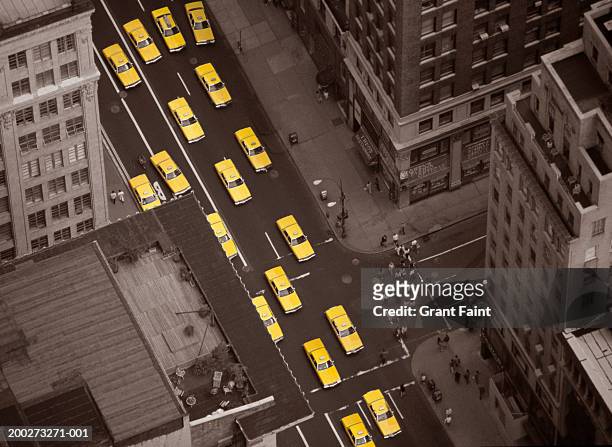 taxi cabs in street, elevated view - touche de couleur photos et images de collection