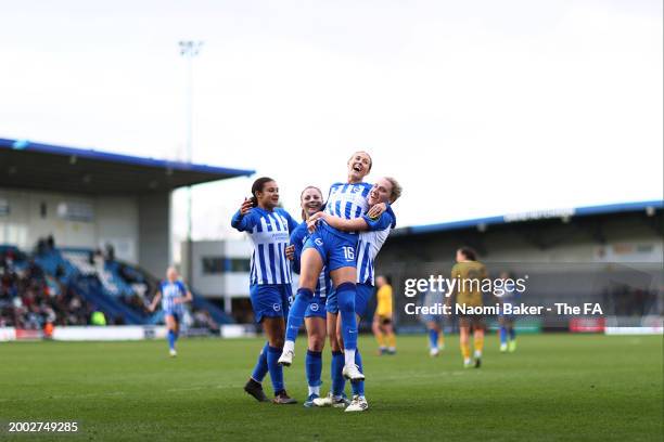 Emma Kullberg of Brighton & Hove Albion celebrates with teammates after scoring her team's fourth goal for her hat-trick during the Adobe Women's FA...