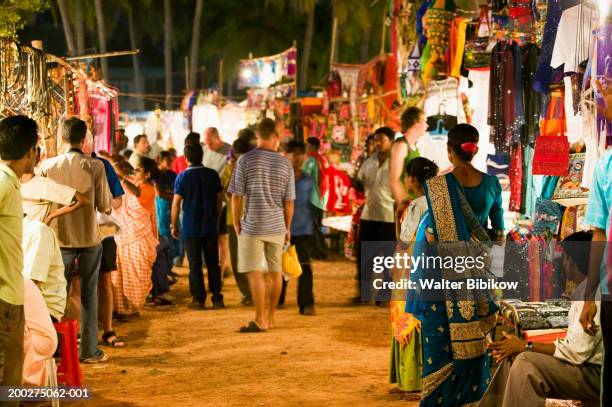 india, goa, baga, saturday evening market - india market stock pictures, royalty-free photos & images