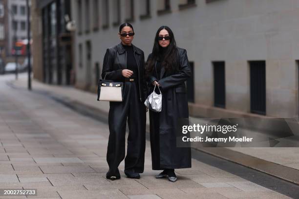 Cherifa Akili wears YSL black sunglasses, gold earrings, Falke black wool knit turtleneck sweater, 12 Storezz black leather jacket, Zara black...