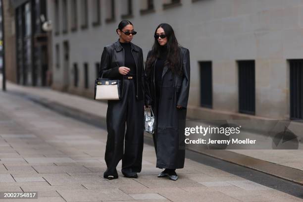 Cherifa Akili wears YSL black sunglasses, gold earrings, Falke black wool knit turtleneck sweater, 12 Storezz black leather jacket, Zara black...