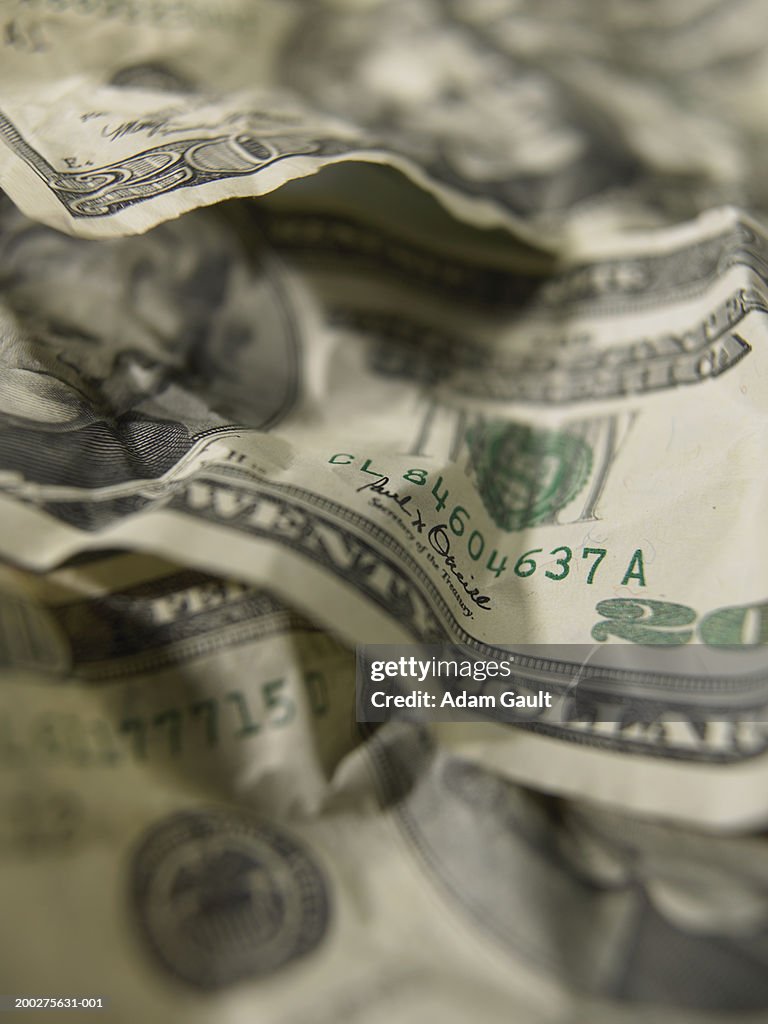 US Currency: Crumpled twenty dolalr bills, close-up