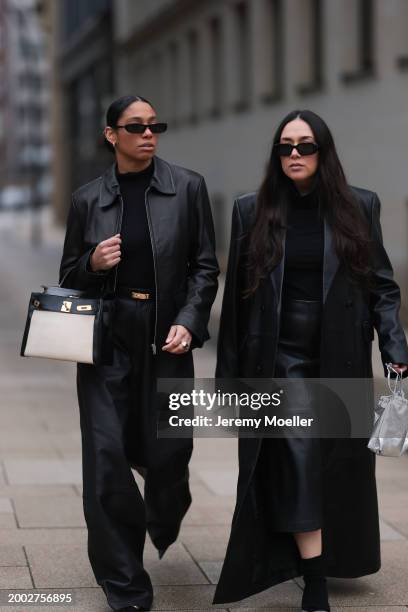 Cherifa Akili wears YSL black sunglasses, gold earrings, Falke black wool knit turtleneck sweater, 12 Storezz black leather jacket, Zara black...