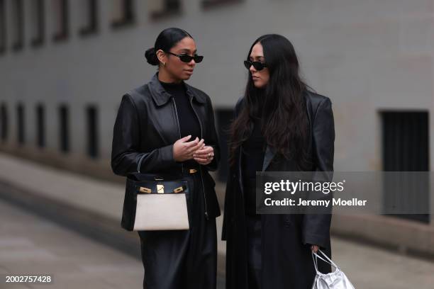 Cherifa Akili wears YSL black sunglasses, gold earrings, Falke black wool knit turtleneck sweater, 12 Storezz black leather jacket, Zara black...