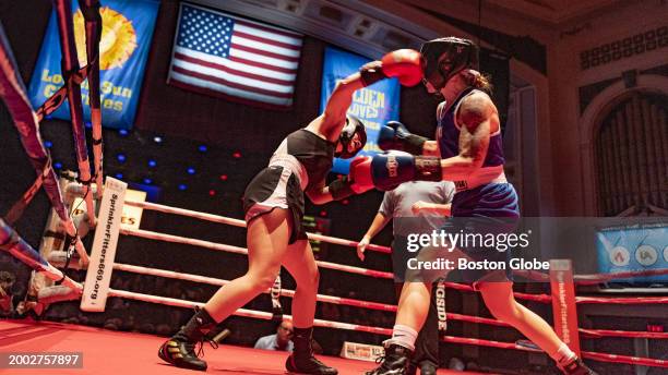 Lowell, MA Katie Donahue lands a punch to the face of Kathryn Rindo. Donahue won a three round unanimous decision.