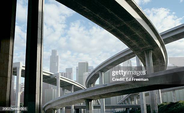 freeway and office buildings, low angle view (digital composite) - multiple lane highway ストックフォトと画像