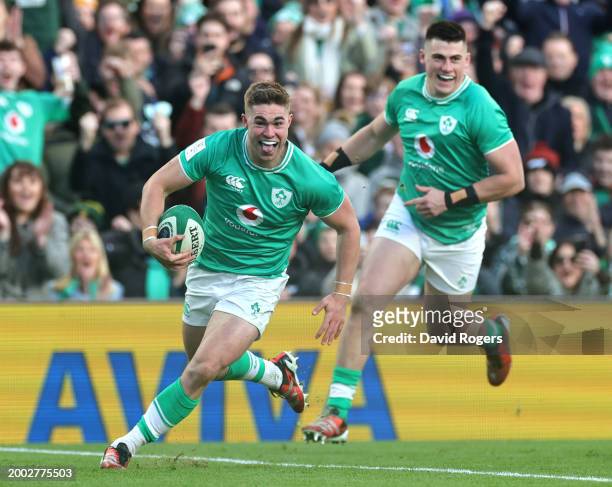 Jack Crowley of Ireland runs into score his team's first try during the Guinness Six Nations 2024 match between Ireland and Italy at Aviva Stadium on...