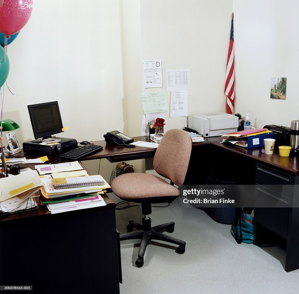 Computer and desk in empty office