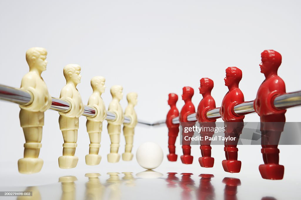 Table soccer figures in red and white