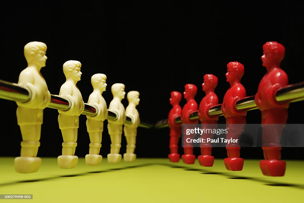 Table soccer figures in red and white
