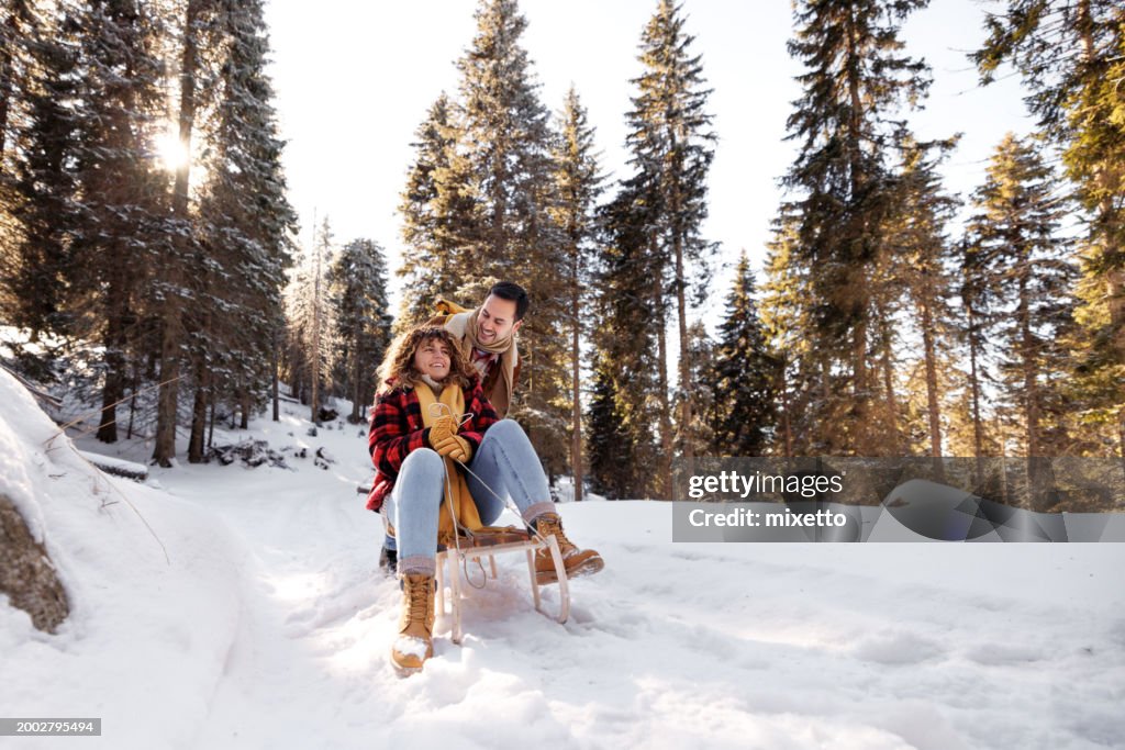 Young couple bonding while enjoying cold winter day together