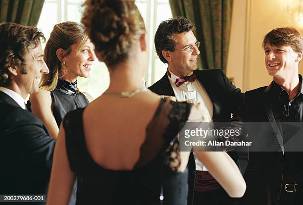 group of people wearing formal attire indoors, smiling - dinner jacket stock pictures, royalty-free photos & images