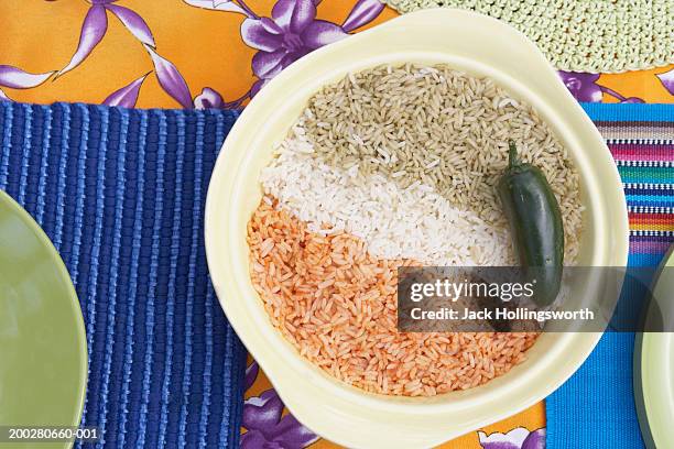 High Angle View Of Tricolored Rice In A Bowl With A Green Pepper High ...